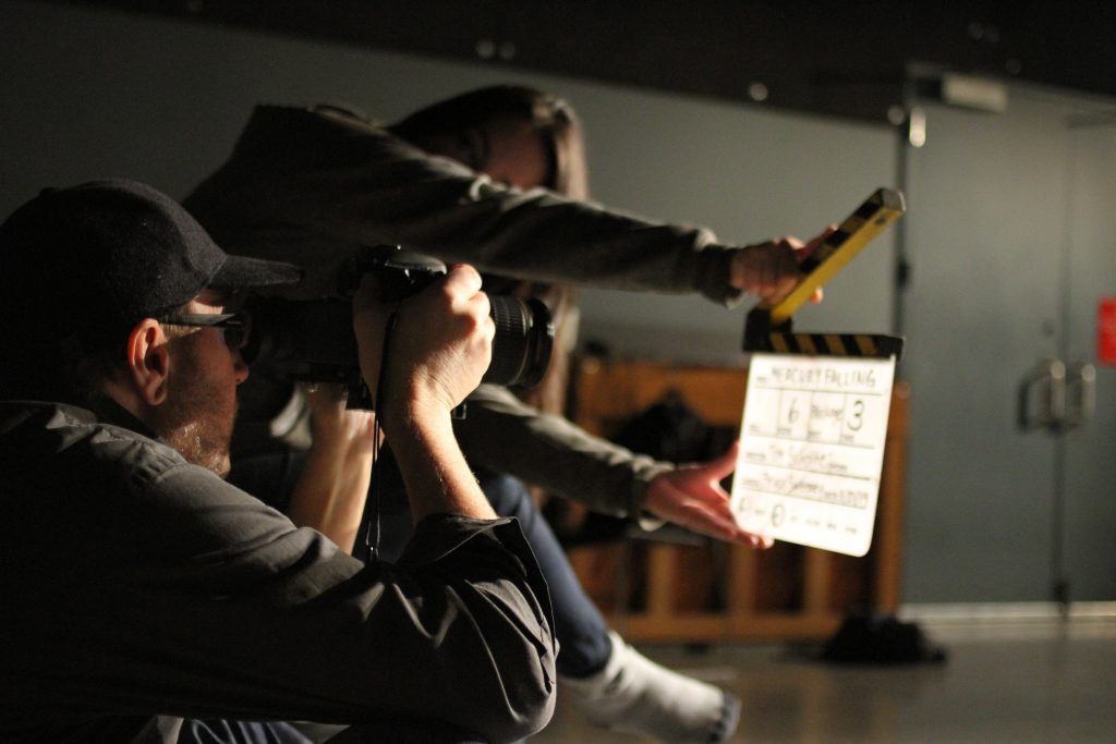 Bruce Sweeney and Nicole Yukiko Sekiya on the set of the Department of Theatre and Film's first feature: Mercury Falling. Photo by Shan Fu.