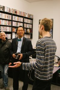 Professor Santa Ono, President of UBC pays a visit to Theatre & Film's Visual Resource Centre with Stephen Heatley and Dmitri Lennikov.